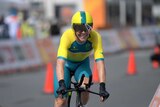 Cyclist Cameron Meyer smiles on his bike after winning time trial