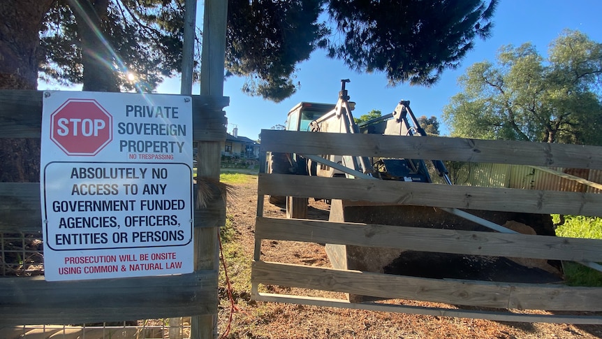 Signage on a wooden fence