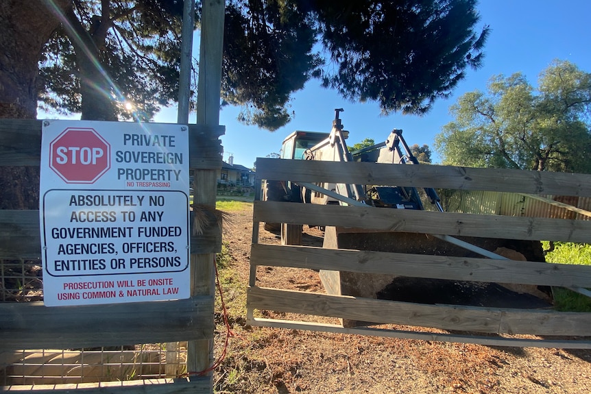 Signage on a wooden fence