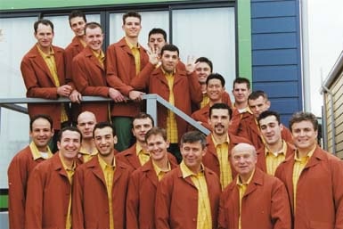 The Australian handball team for the 2000 Sydney games poses for a team photo on a staircase.
