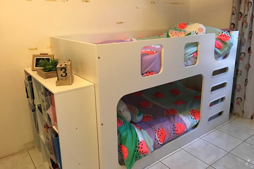 A bunk bed arrangement in a bedroom.