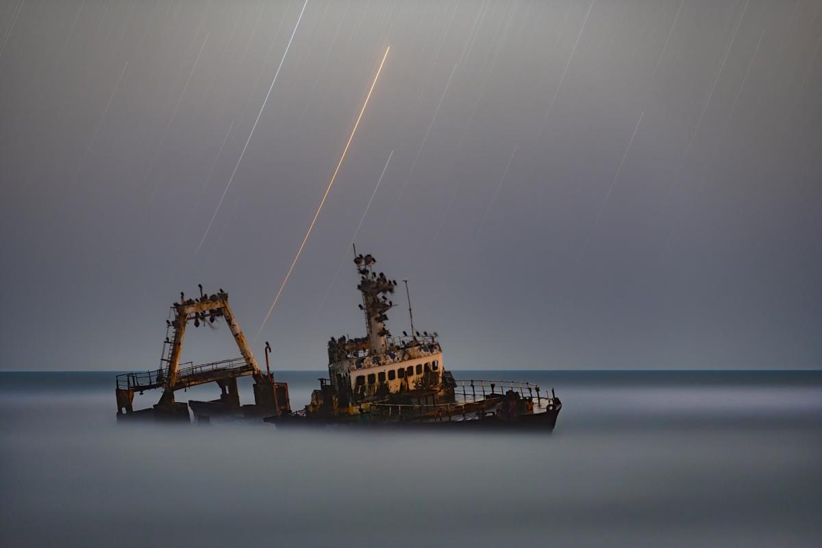 A shipwreck surrounded by clouds.