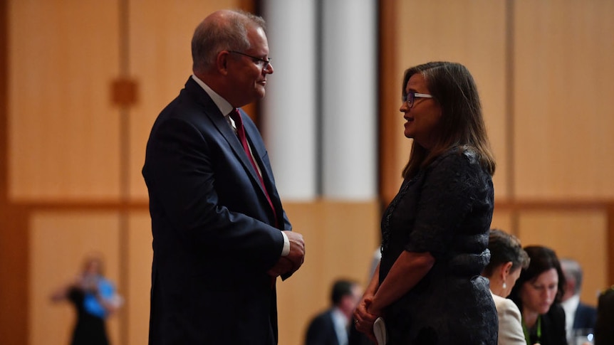Prime Minister Scott Morrison (left) and Sex Discrimination Commissioner Kate Jenkins (right) in profile at Parliament House
