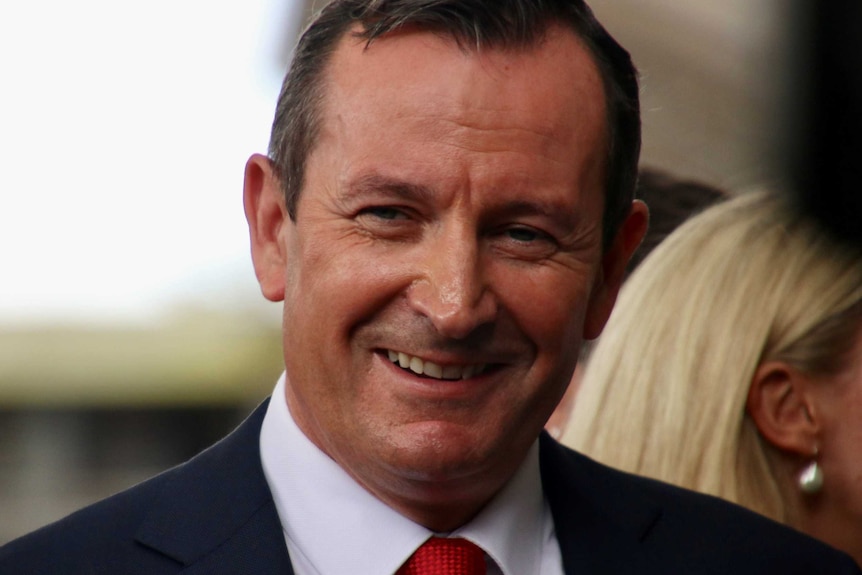 A tight head shot of a smiling Mark McGowan.