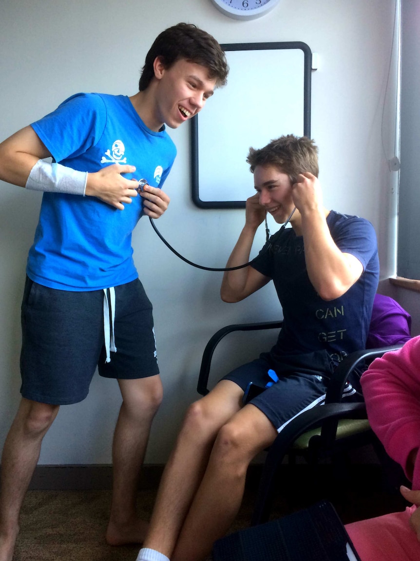 Patrick Denny jokes around with a friend during a visit to hospital in 2016.