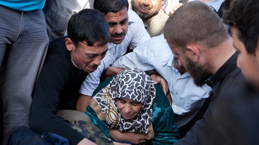 A mother mourns the death of her son in Syria