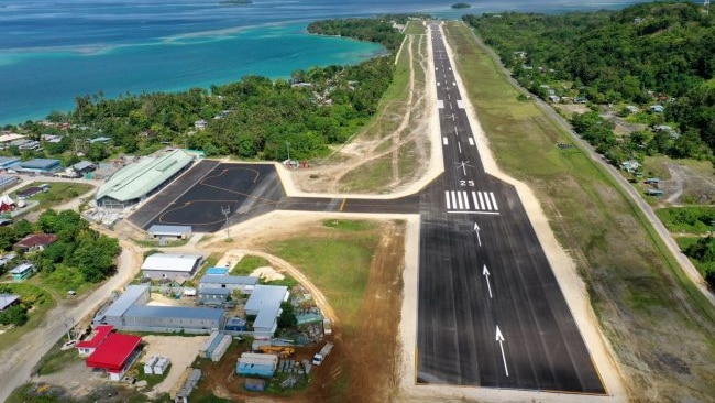 Aerial view looking at the runway and buildings of Munda Airport 