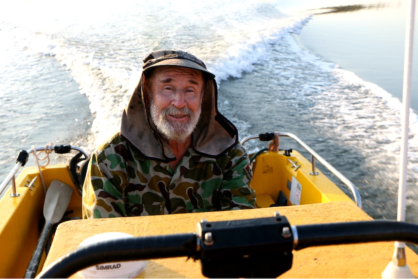 A close up photo of Don McLeod travelling in his boat on the Drysdale River.