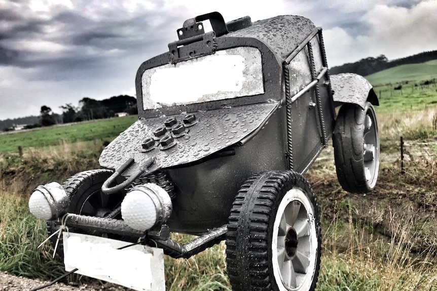 a letterbox in the design of an army tank