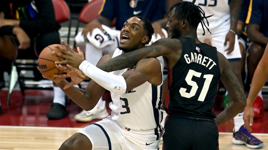 Miami Heat guard Marcus Garret blocks Utah Jazz guard Trent Forrest during an NBA summer league basketball game