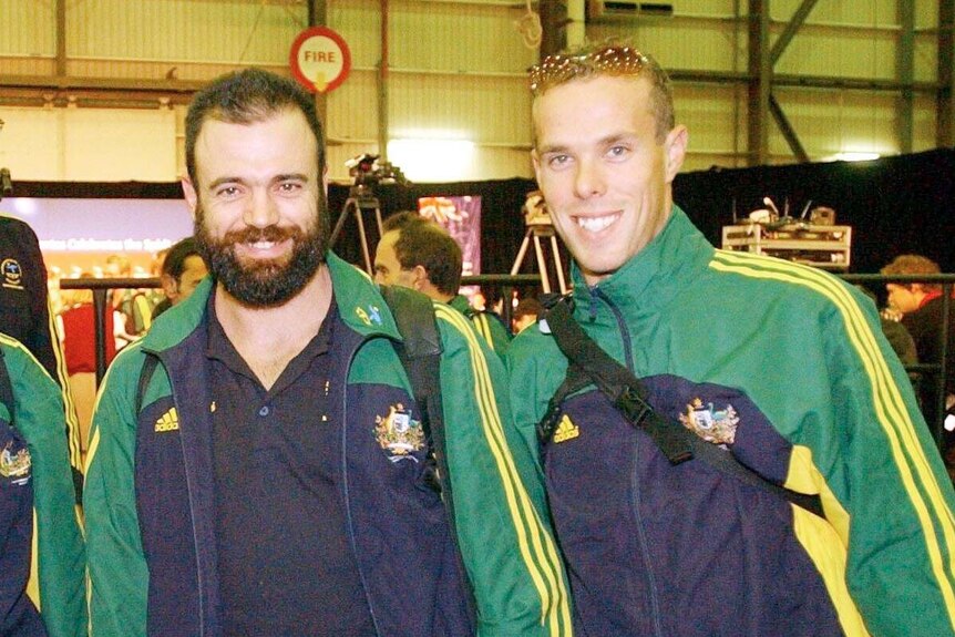 Stepehn Wooldridge stands with two team-mates before leaving for the 2002 Commonwealth Games.