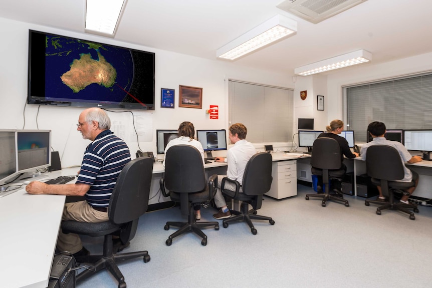 Scientists sitting at computers.