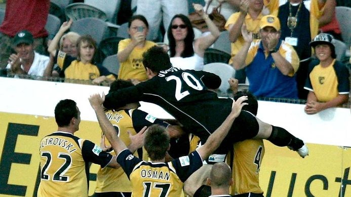 Central Coast Mariners players celebrate the goal scored by team-mate John Hutchinson