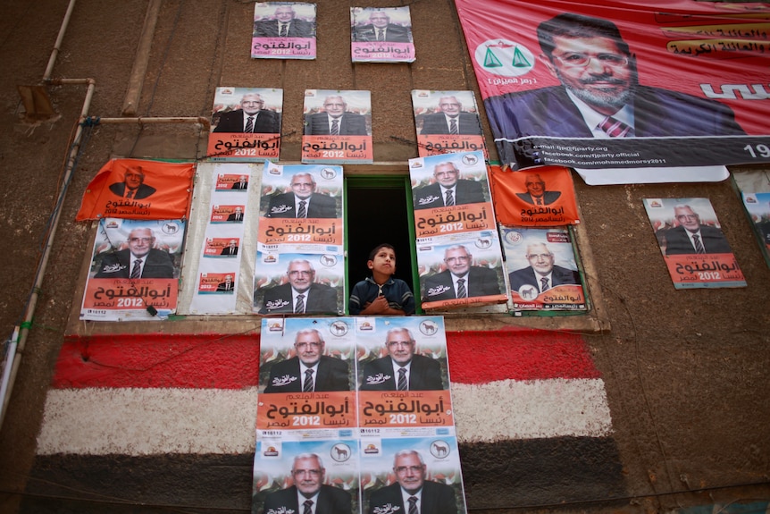 Window plastered with campaign posters