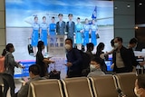 Passengers prepare to board a flight at the airport in north-central China's Jiangxi province.