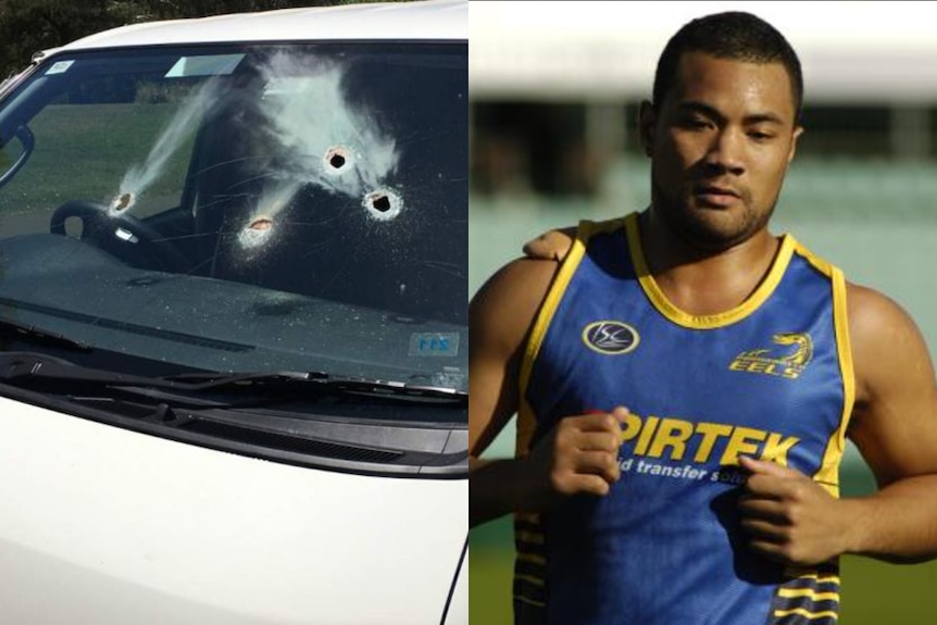 A van window with small holes and an NRL player.