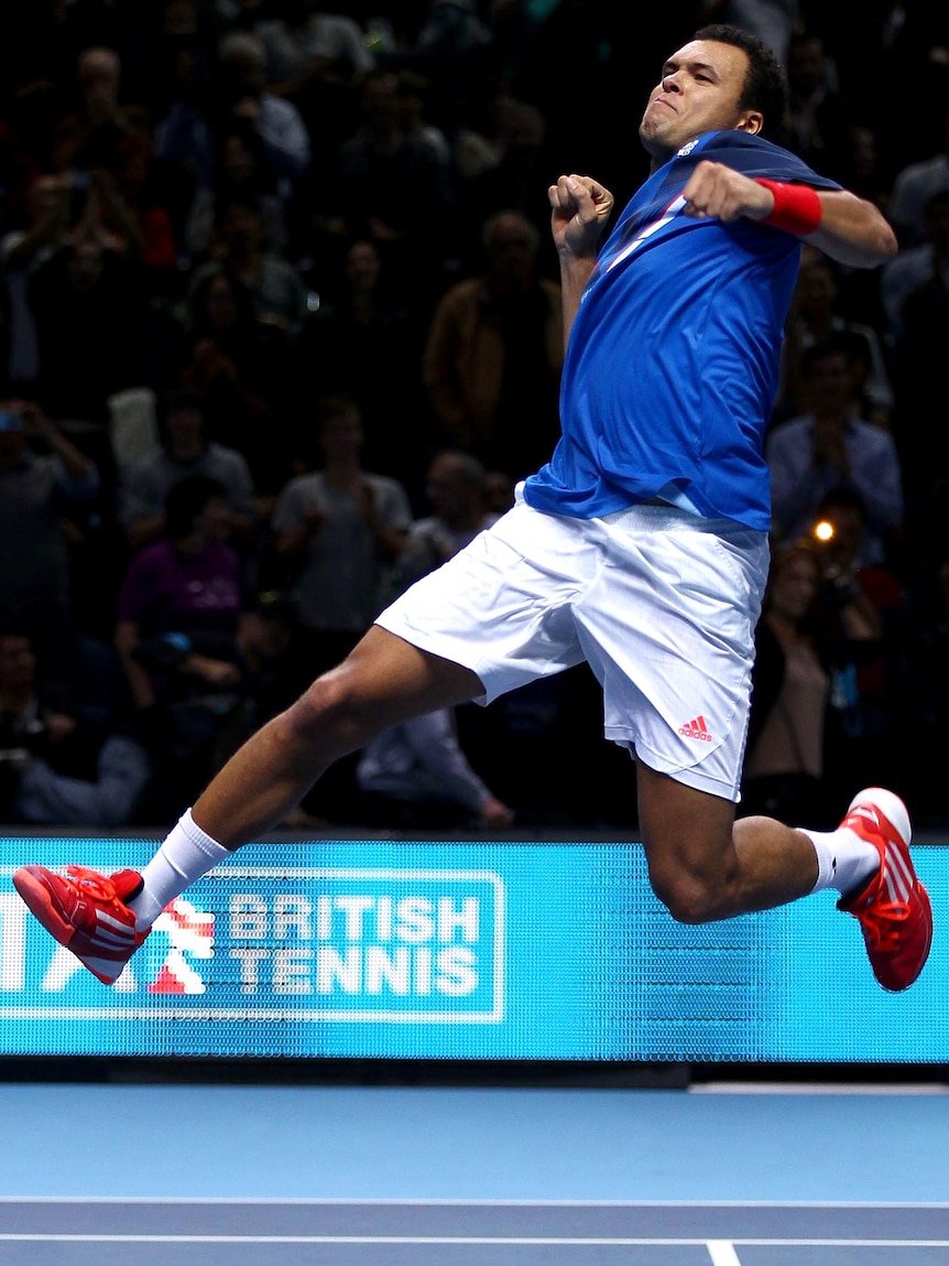 Jo-Wilfried Tsonga celebrates winning his match against Rafael Nadal.