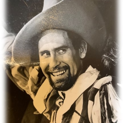 Black and white photo of Haddrick wearing Shakespearean costume and hat.