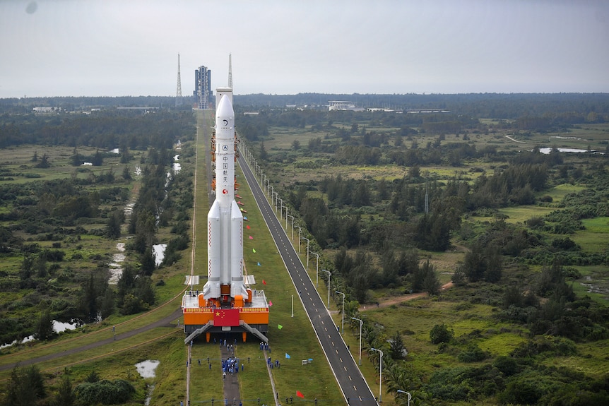 A rocket being moved on a transport platform.