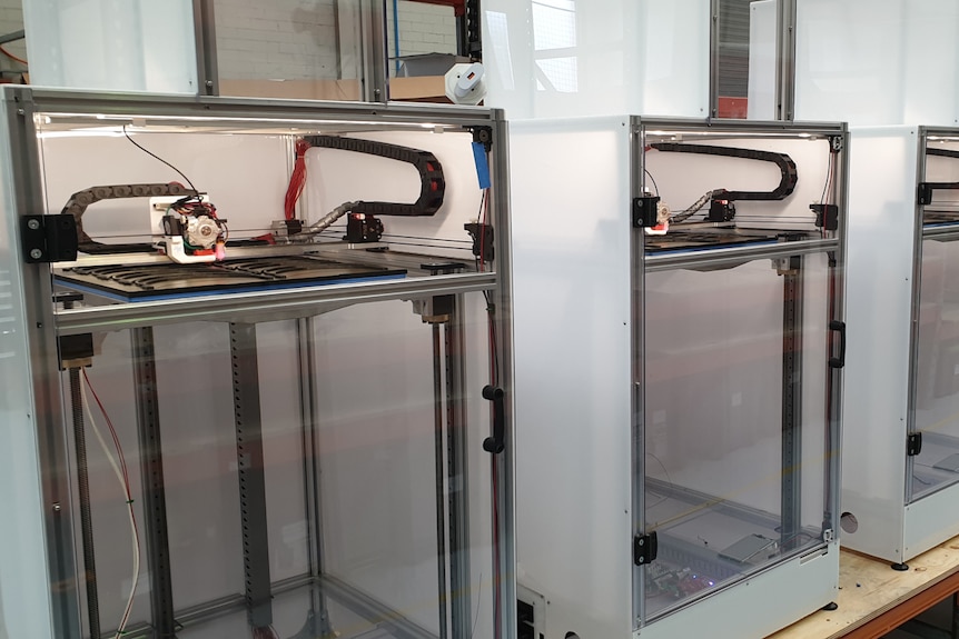 3D printing machines lined-up.