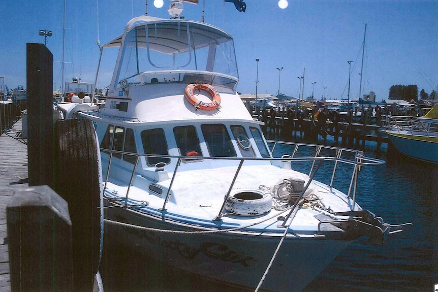 The boat Damien Mills was on when he disappeared. The boat is tied-up at a jetty.