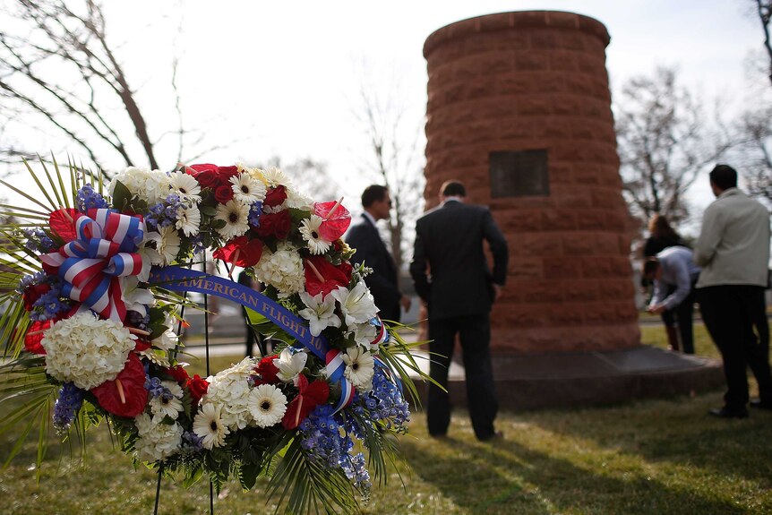 Family members surround a cairn dedicated to those who died on Pan Am Flight 103.