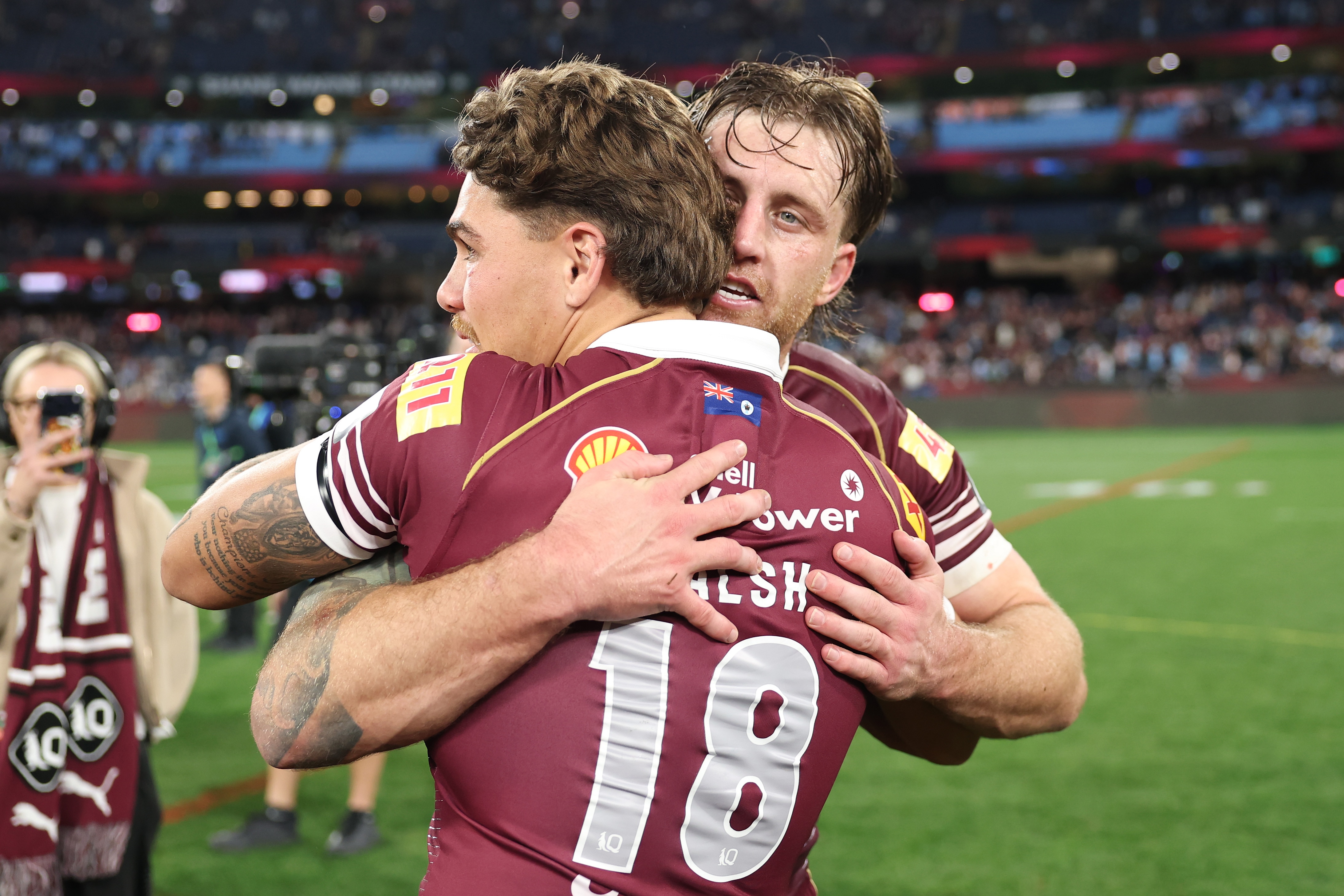 Cameron Munster hugs Reece Walsh after State of Origin II.