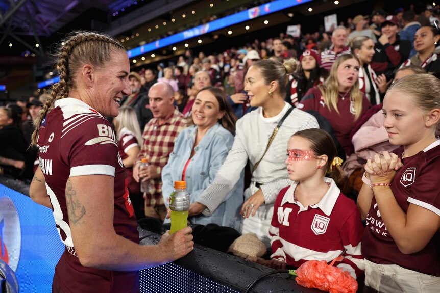 Queensland captain Ali Brigginshaw speaks to her family in the stands after Women's State of Origin I.