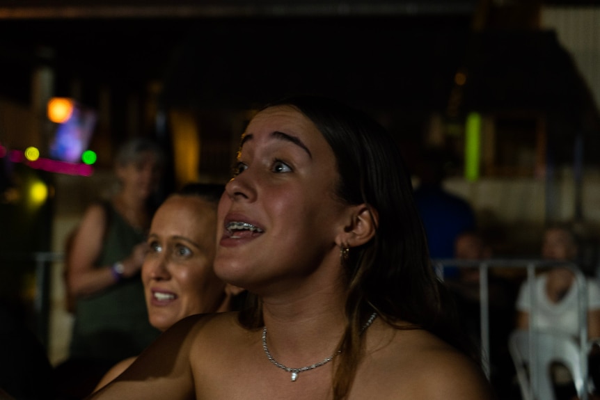 girl shouting in suspense at fight 