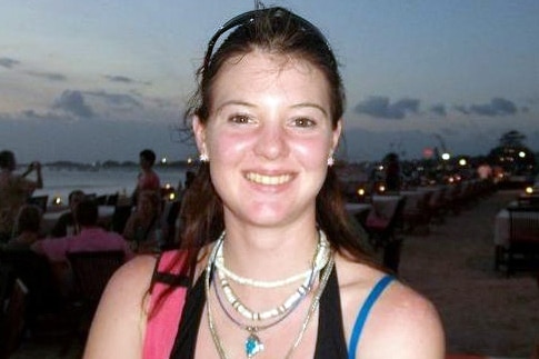 Leisl Smith, a young woman with dark hair, smiles into the camera, wearing a singlet top.