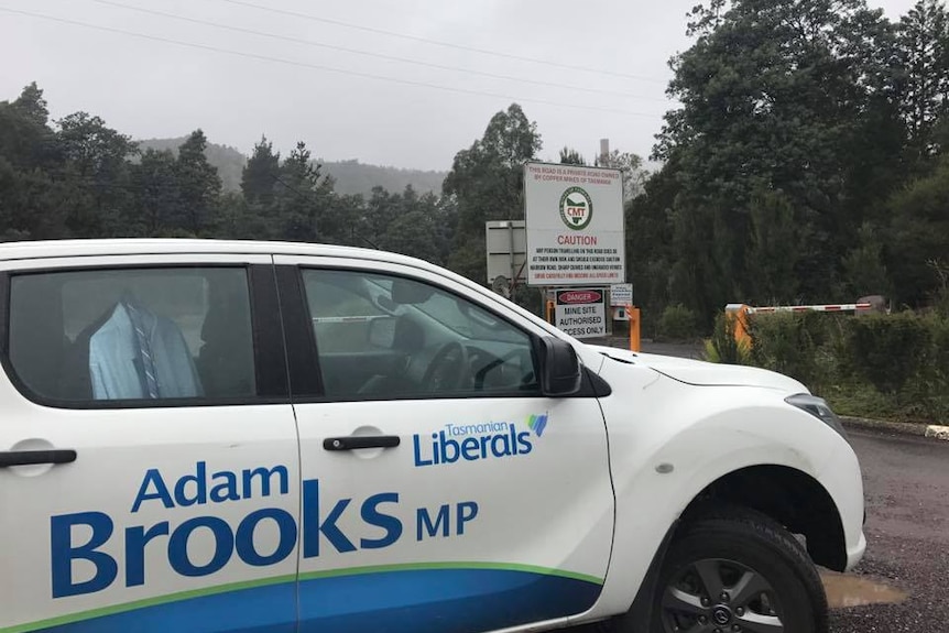 Tasmanian Liberals party car parked on the side of the road.