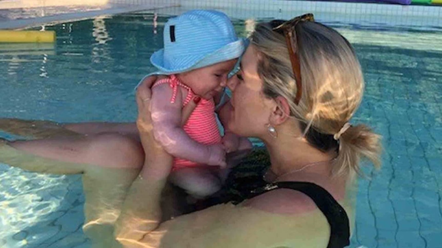Grace Jennings-Edquist with her baby in the pool to depict her story about learning to love her post-baby body