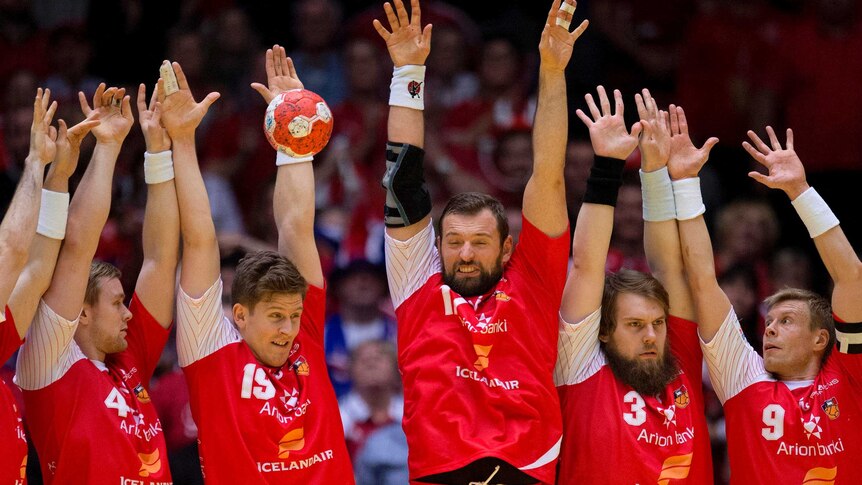 The Iceland handball team defend a shot during their Euro 2014 Handball Championship match against Denmark.