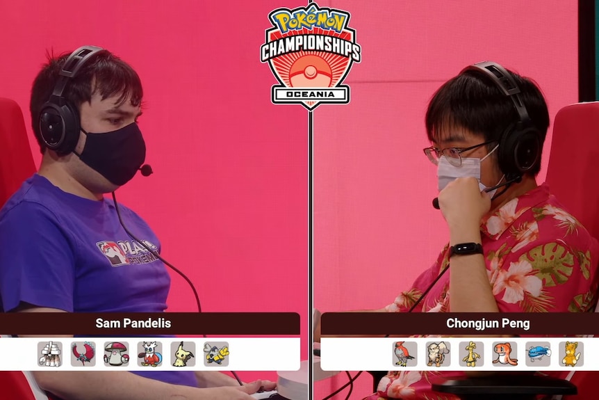 Two men with face masks playing a pokemon battle