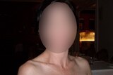 Pixellated face of a woman in a restaurant