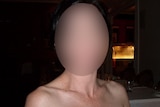 Pixellated face of a woman in a restaurant