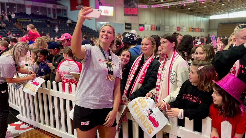 Eleanor Cardwell poses for a photo with fans