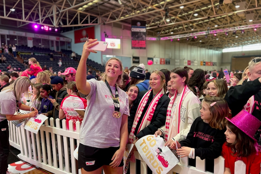 Eleanor Cardwell poses for a photo with fans