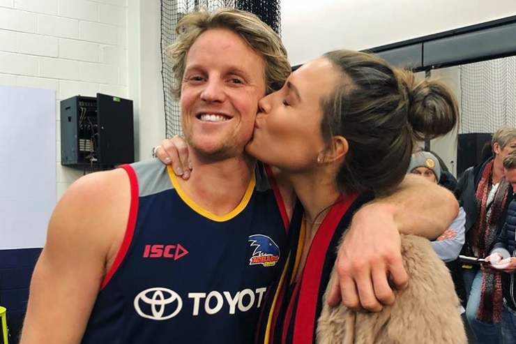 Adelaide Crows player Rory Sloane embraces wife Belinda Sloane.