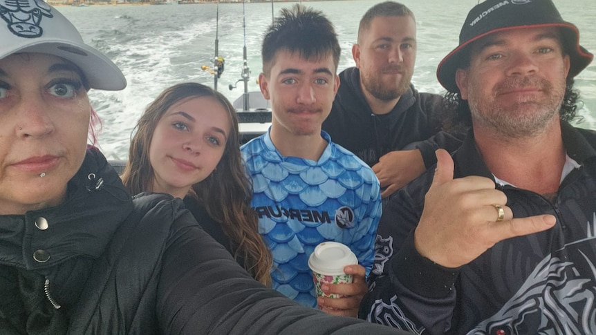 Av Mason and his family on their boat
