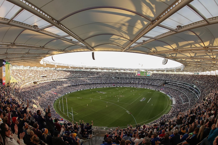 Aerial photo of a stadium with a packed crowd