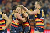 Crows players celebrate a goal against Geelong at Adelaide Oval on July 21, 2017.