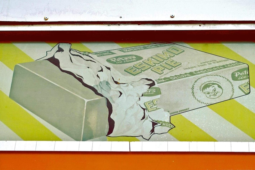 An old sign advertisement for a Peters Eskimo Pie.