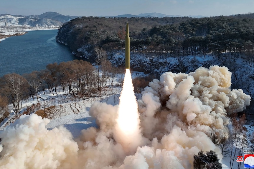 A missile being shot from a snowy landscape