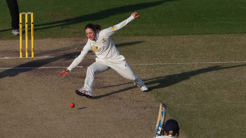 Australia's captain Rachael Haynes spreads her arms as she tries to catch a ball.