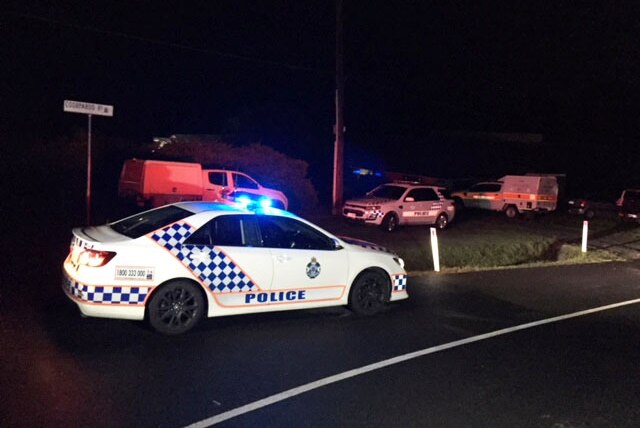 Police cars on the road outside a property where a man was killed in a gas cylinder explosion.