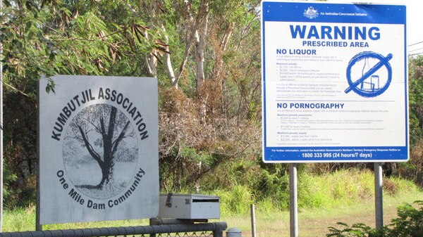 Signs outside One Mile Dam community, near Darwin.