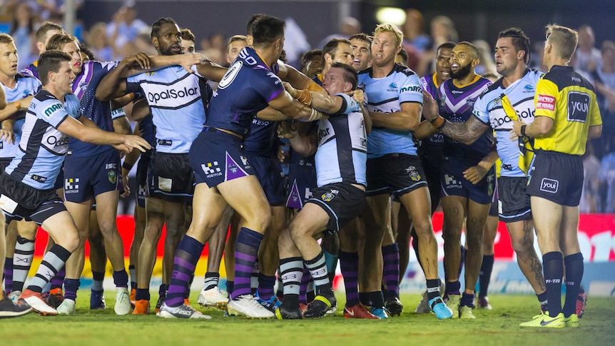 Nelson Asofa-Solomona of the Storm and Paul Gallen of the Sharks square off at the end of the game.