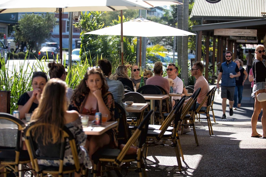 Diners at outside tables on Byron's main street