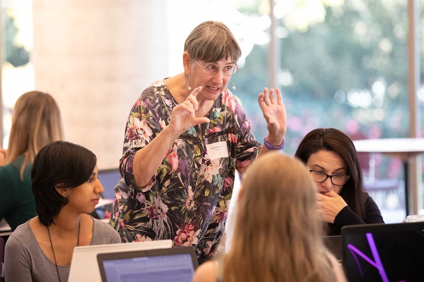 Margaret Donald giving instructions to a group of volunteers at the event.